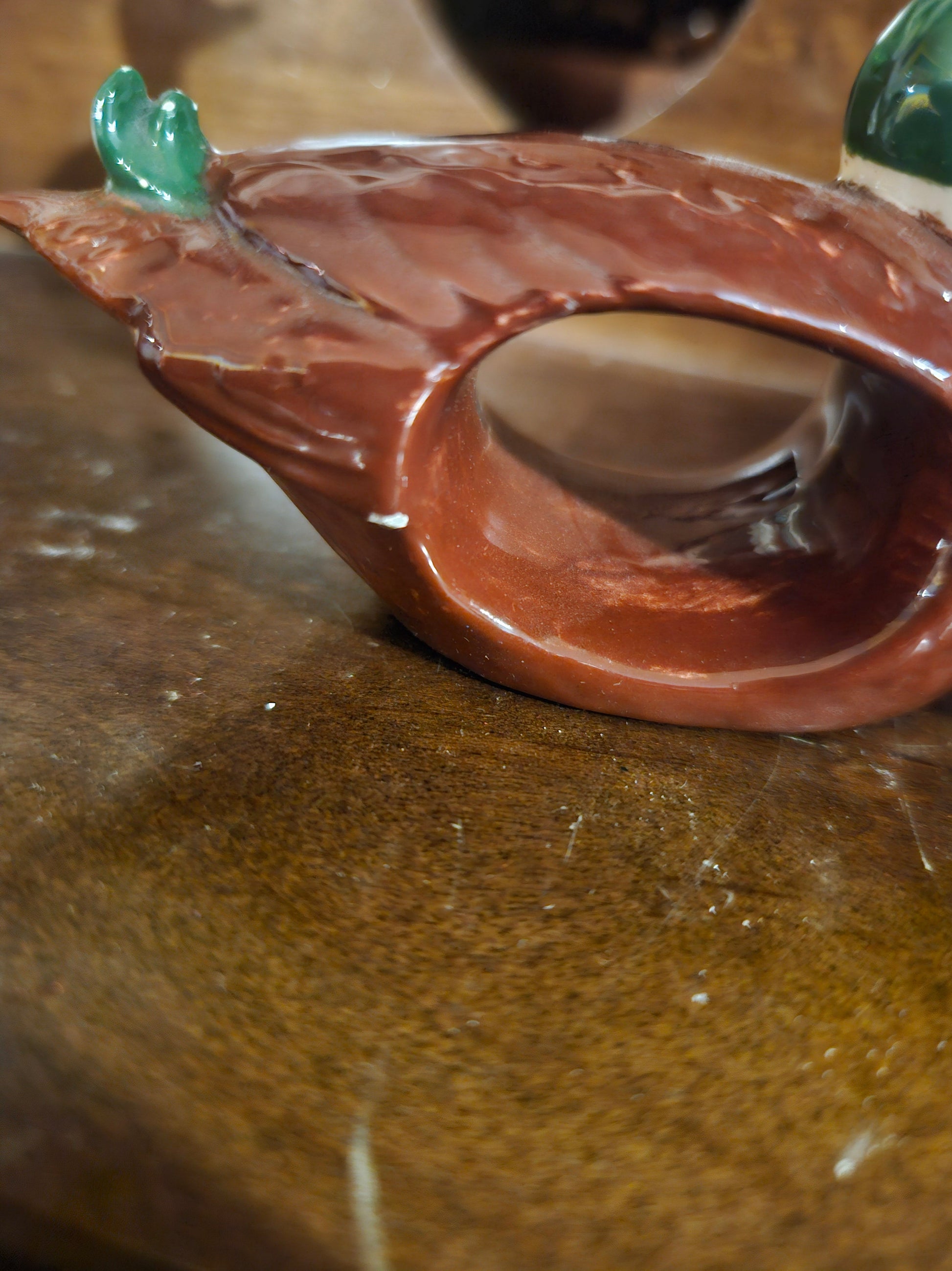 Underside of mallard duck napkin ring showing hollow opening for napkin