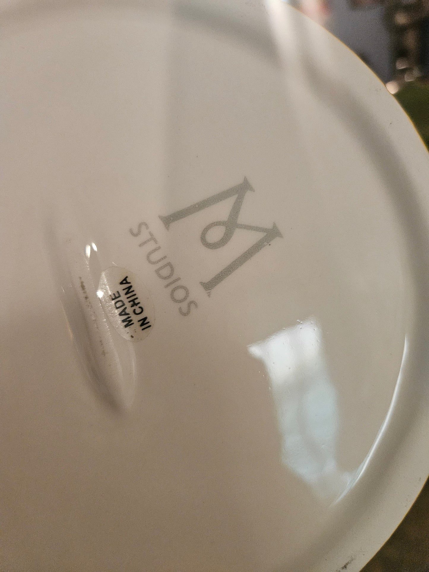 Bottom of Dorothy cake stand showing M Studios maker mark and Made in China