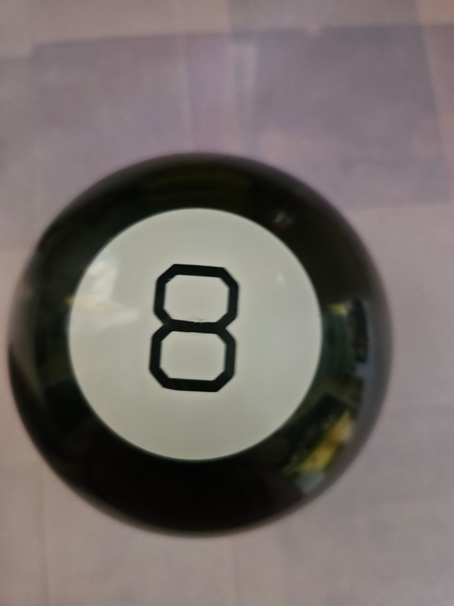 Vintage Magic 8 Ball front showing the number 8