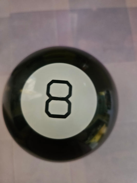 Vintage Magic 8 Ball front showing the number 8