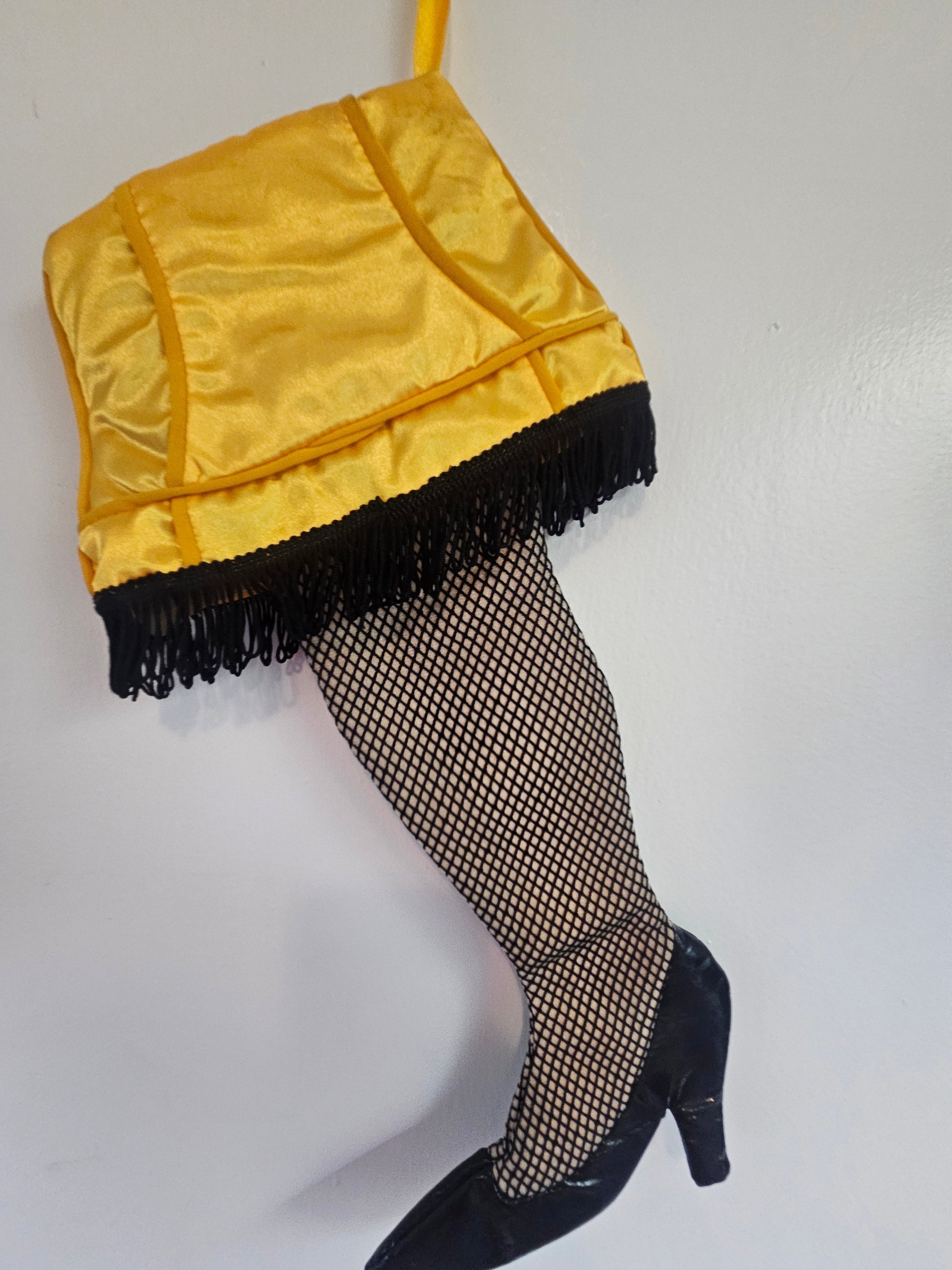 A Christmas Story Leg Lamp stocking side view showing gold quilted shade and fishnet leg detail