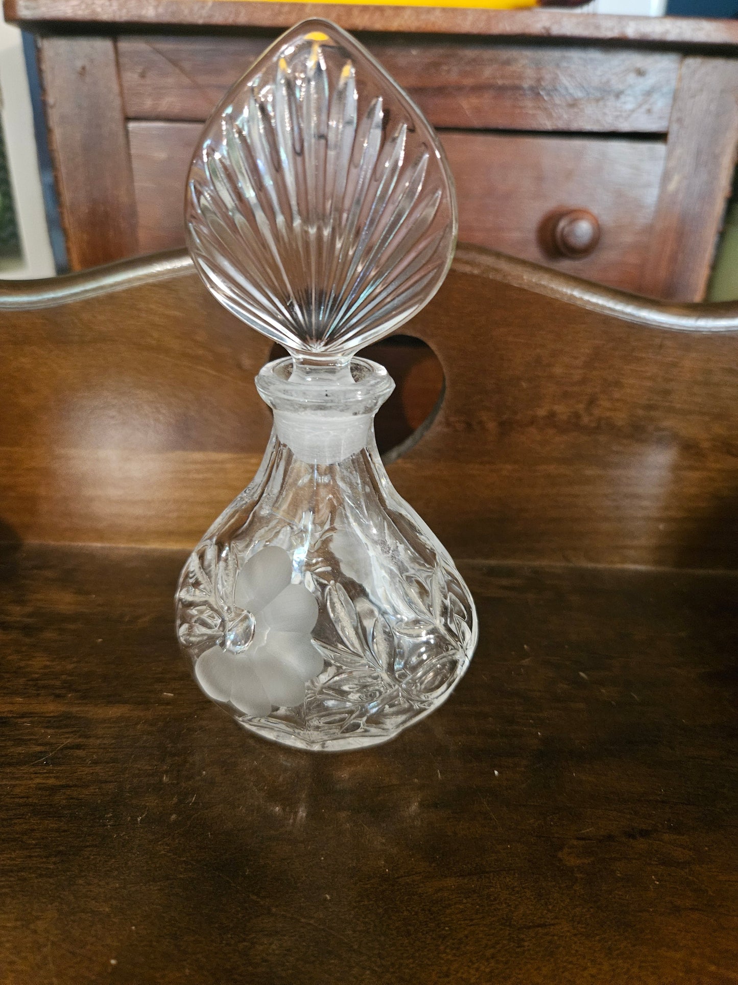 Vintage cut crystal perfume bottle with fan stopper and frosted grape etching, front view