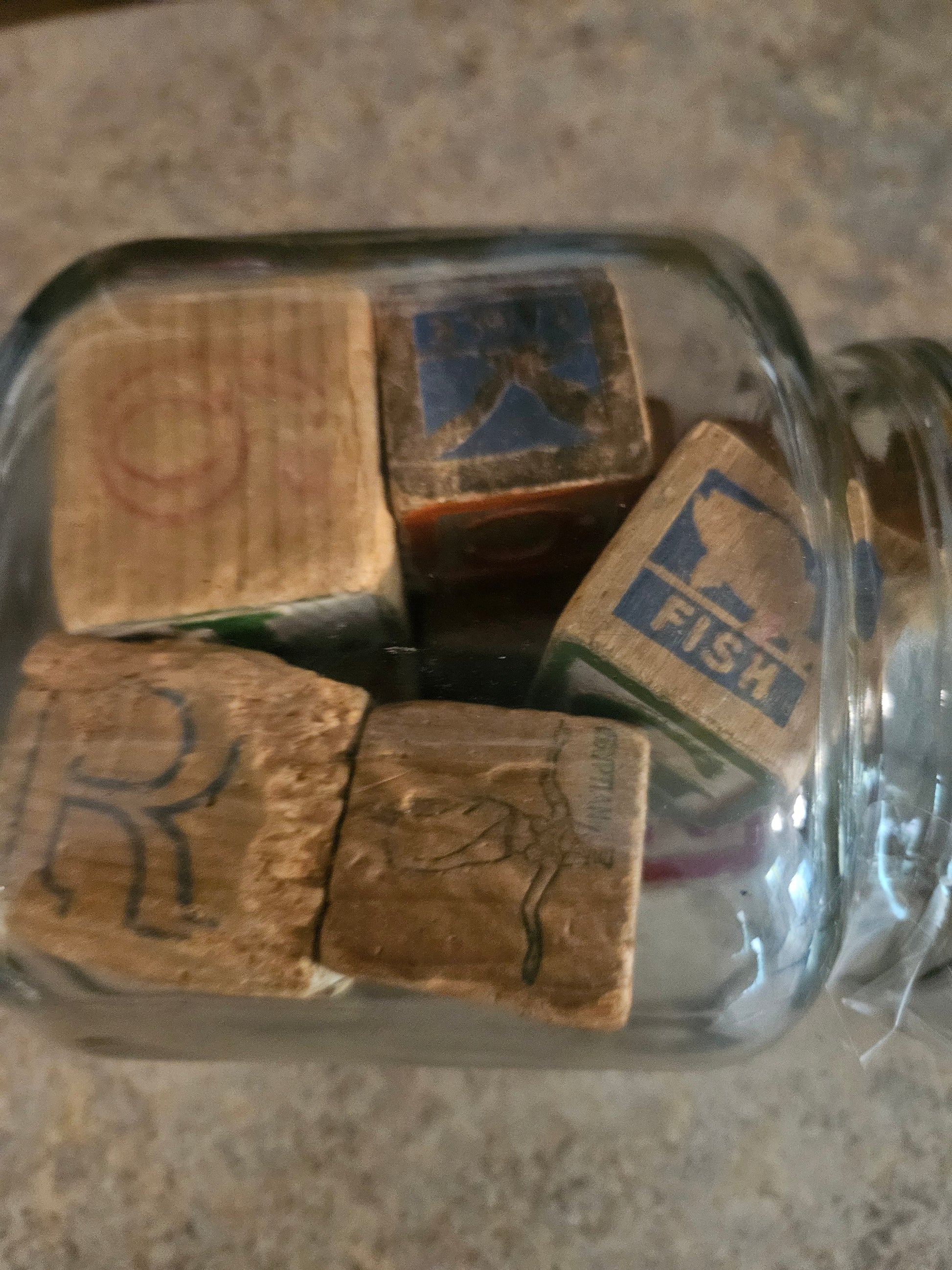 Interior of jar showing picture blocks including FISH block and embossed animal blocks