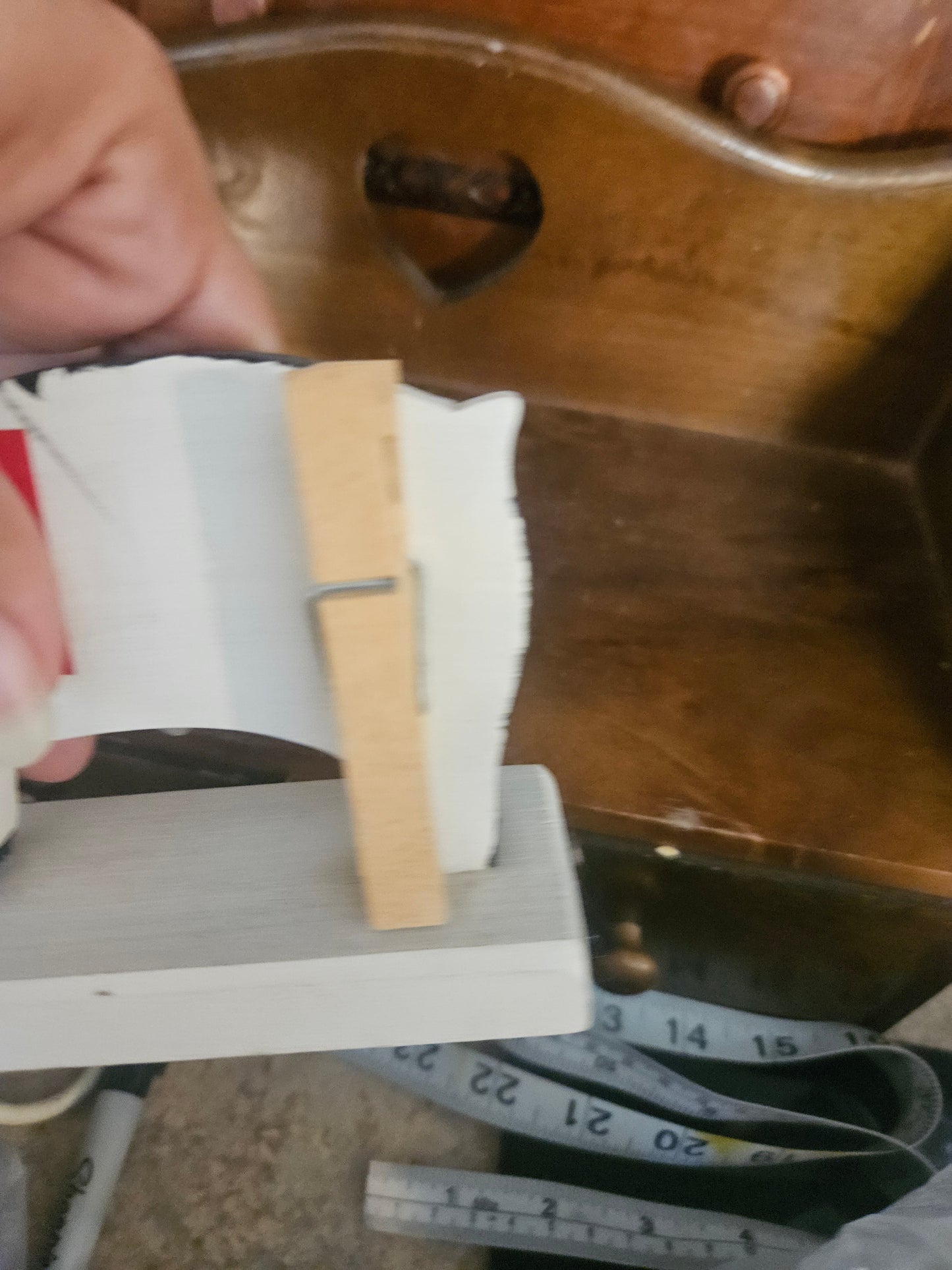 Back view showing natural wood card slot on top of pig and approximate size