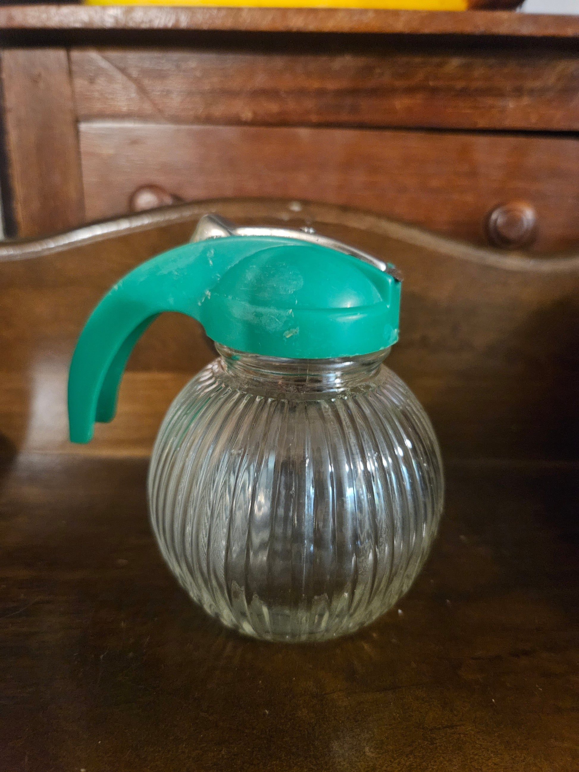 Hazel Atlas ribbed globe syrup dispenser with teal turquoise flip lid and handle, front view