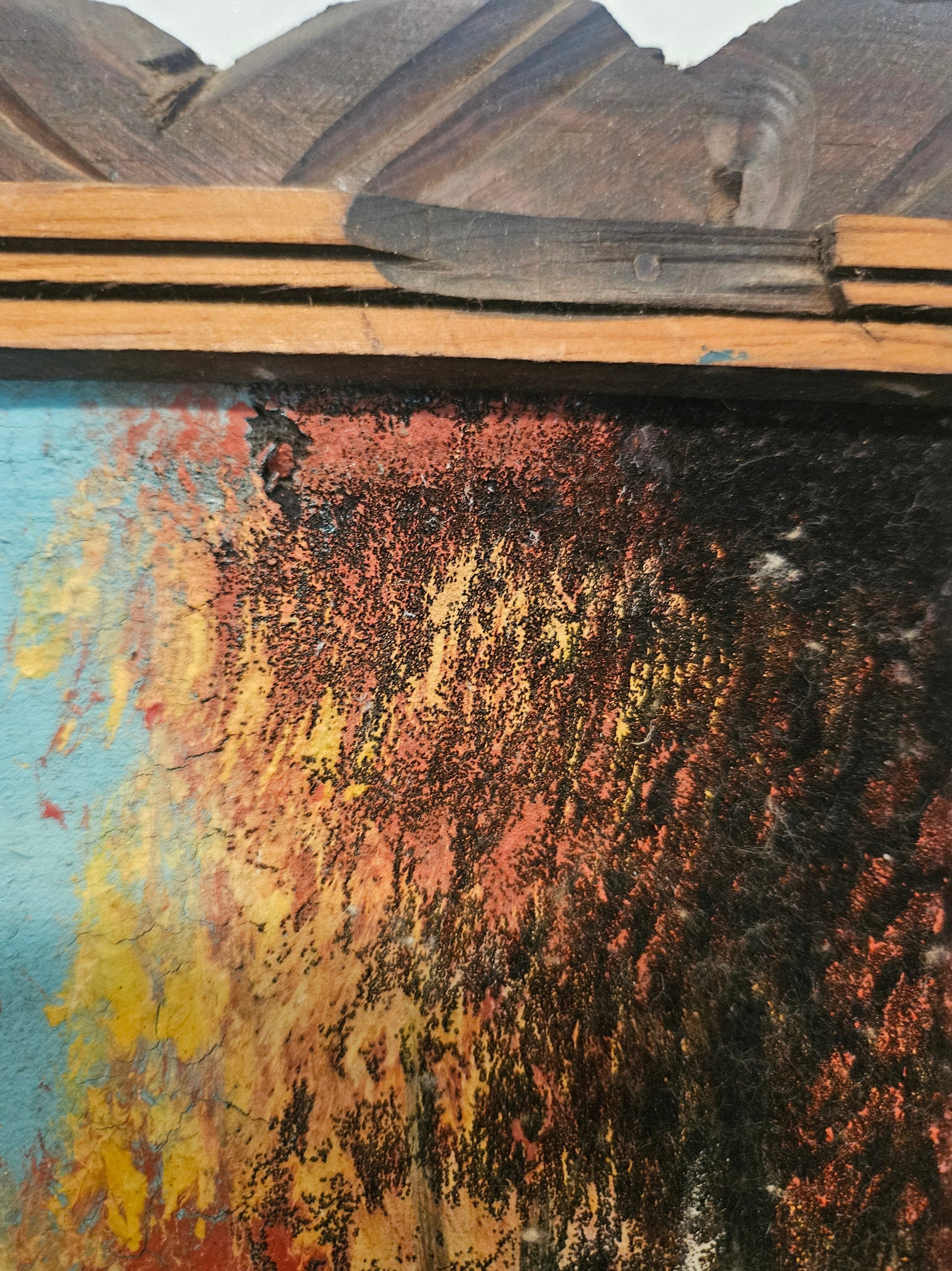 Close up of velvet painting surface showing thick impasto paint texture and small spot detail