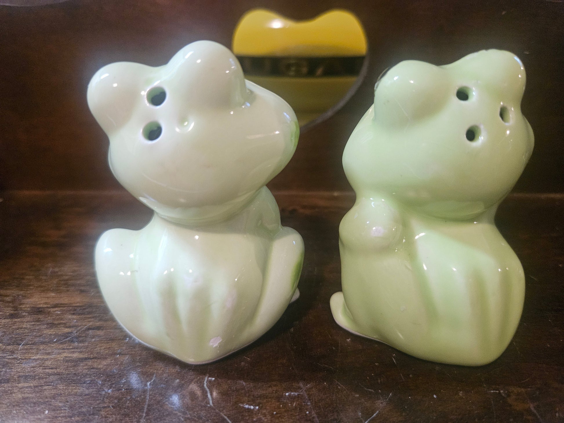 Back view showing shaker holes on top of heads and rubber stoppers