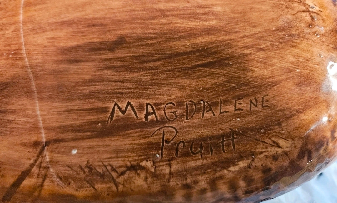 Bottom of baked potato cookie jar showing incised Magdalene Pruitt artist signature