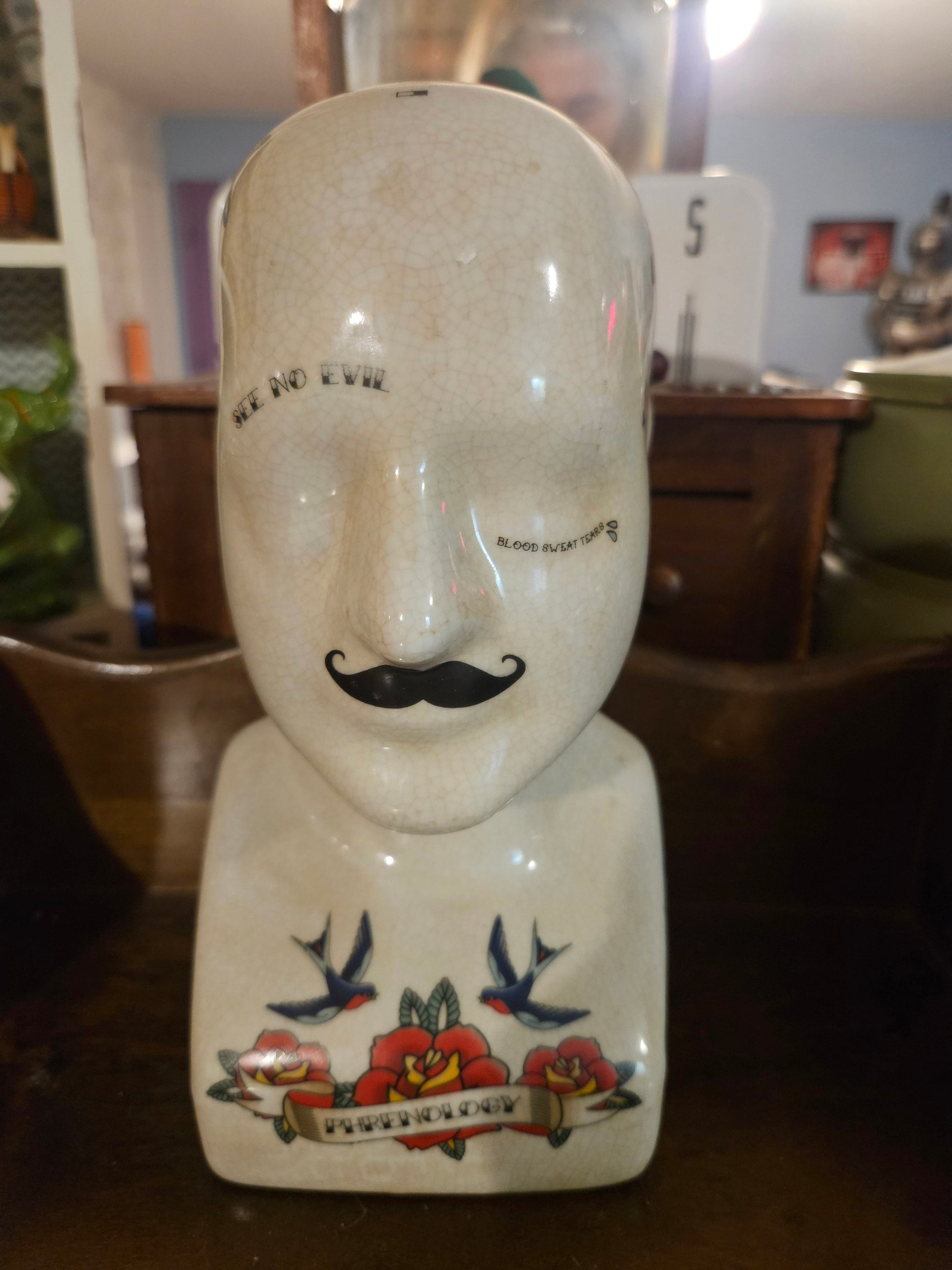 Ceramic tattoo flash phrenology head planter front view showing mustache see no evil text swallows and roses